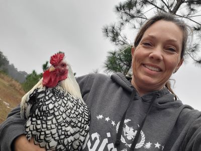 picture of Tracye holding rooster